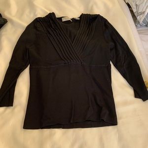 Black or chocolate rayon sweater. Great stretch!